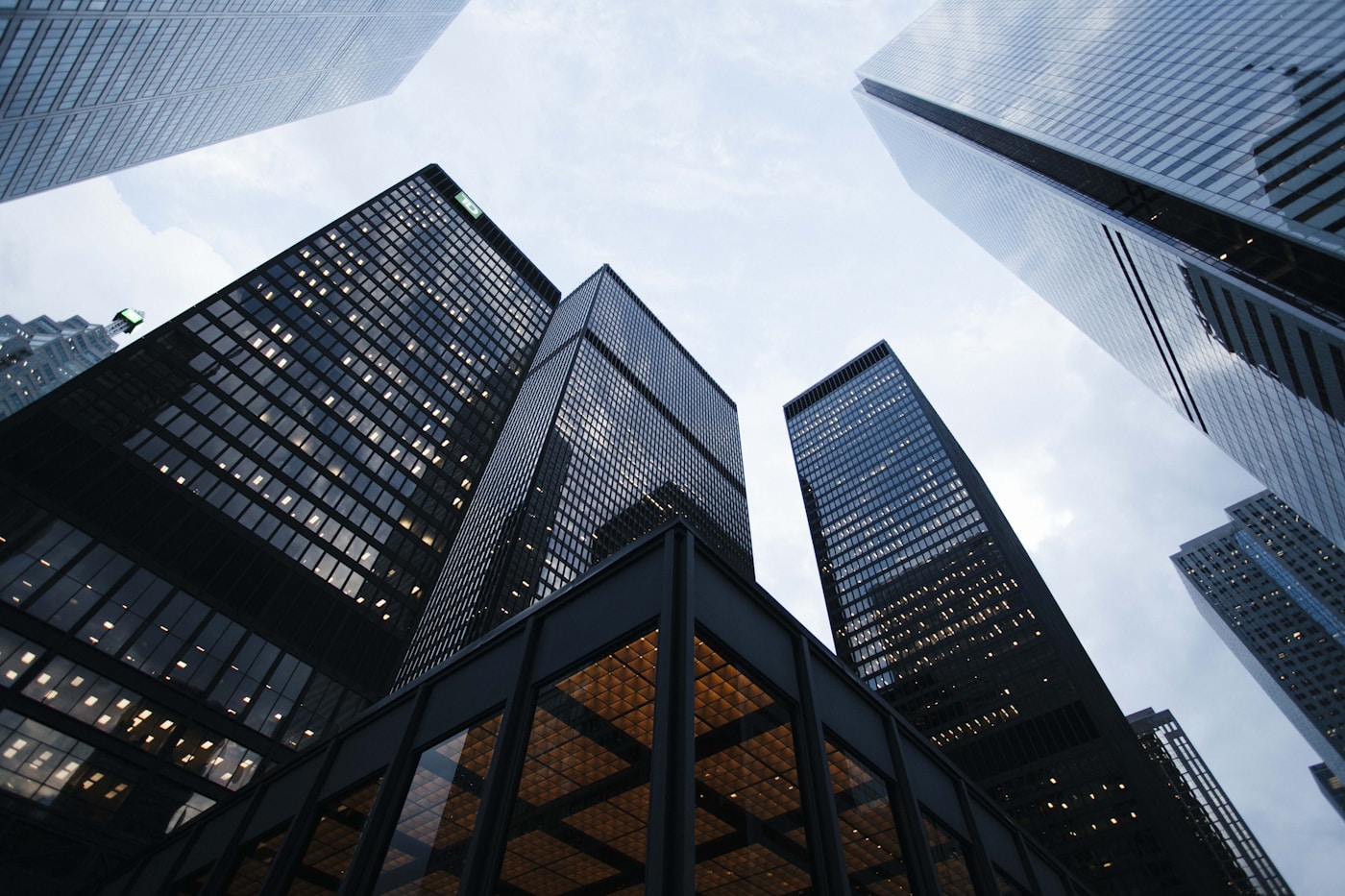 Glass architecture viewed from below, revealing a wider perspective